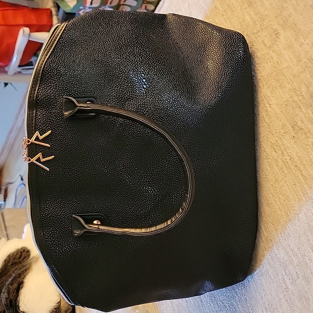 Black fauxe leather over the shoulder